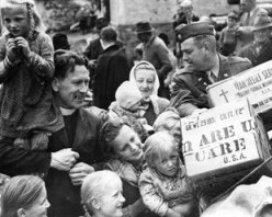 In 1947 Americans fed a "silent guest" during the holidays and this led to a CARE package going overseas to feed the hungry.Credits: CARE