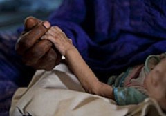 A mother attends to her severely malnourished child at an inpatient feeding centre in Mao, Chad. Plumpy'Nut is used to treat this potentially deadly condition (UNICEF Chad/2011/ Esteve)